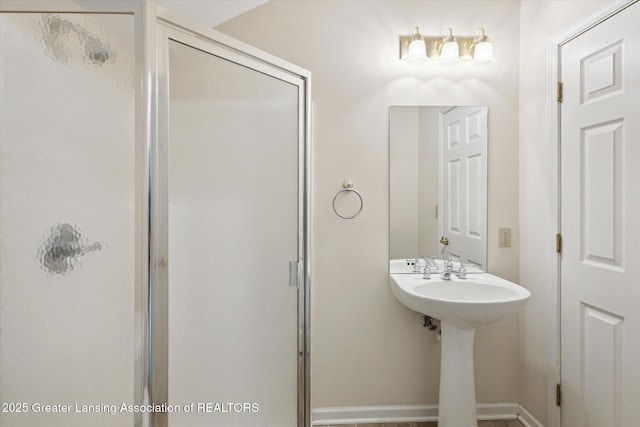 bathroom with a shower stall