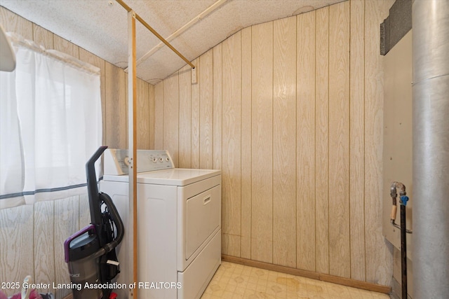 washroom featuring laundry area, wood walls, and light floors