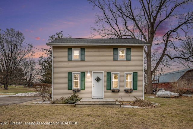 colonial house with a lawn