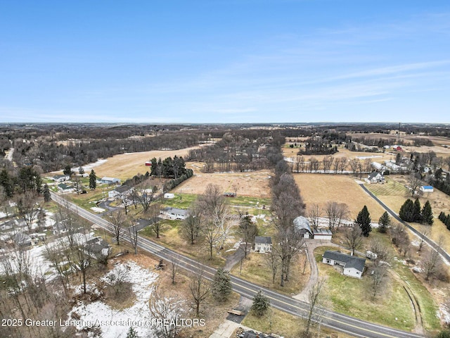 birds eye view of property featuring a rural view