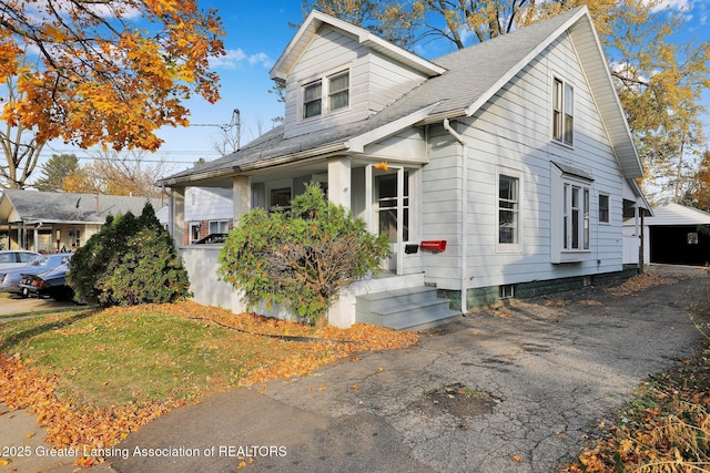 view of front of house featuring a porch and a shingled roof