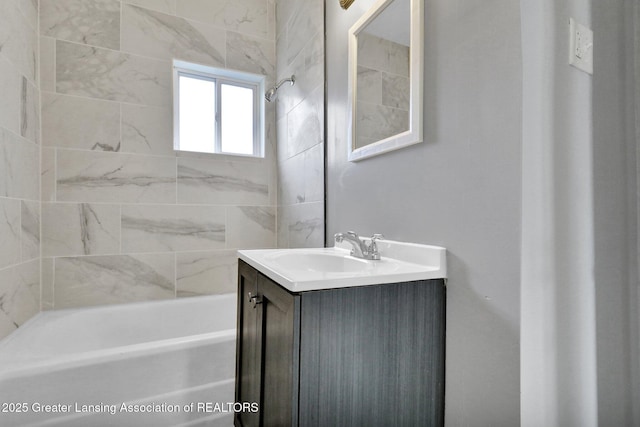 full bath featuring vanity and bathtub / shower combination