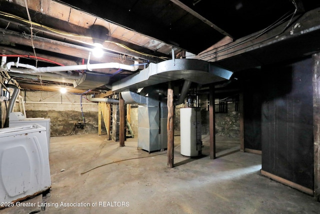 unfinished basement featuring heating unit, washer / clothes dryer, and water heater