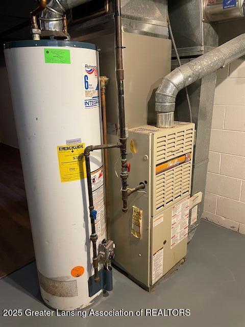 utility room with water heater