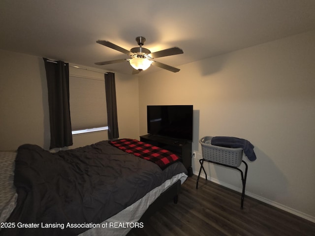 bedroom featuring ceiling fan, baseboards, and wood finished floors