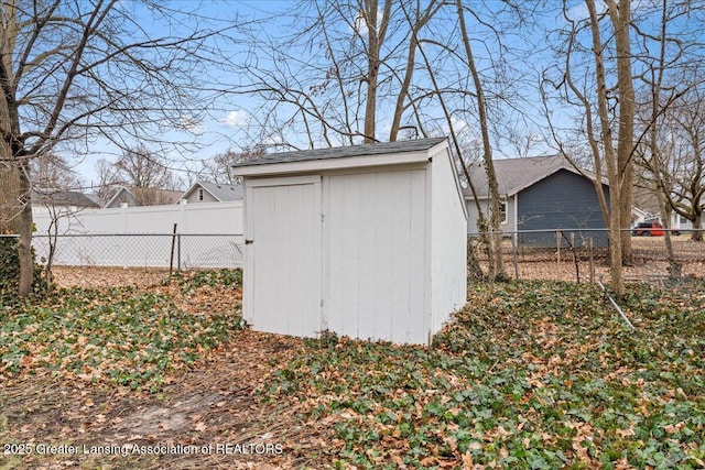 view of shed featuring a fenced backyard