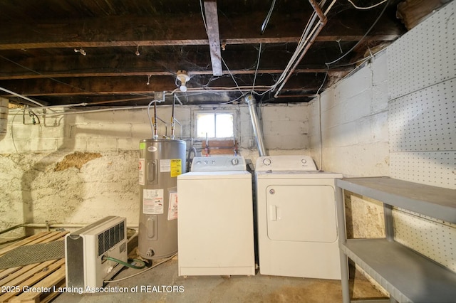 below grade area featuring independent washer and dryer and electric water heater