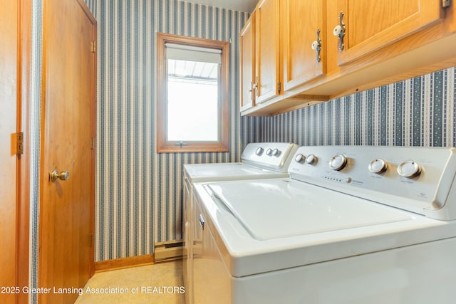 laundry area featuring washer and clothes dryer, cabinet space, light tile patterned flooring, baseboards, and wallpapered walls