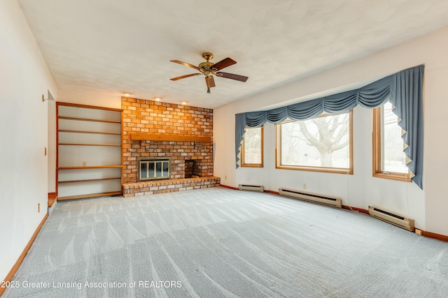 unfurnished living room featuring carpet, a baseboard radiator, and a fireplace