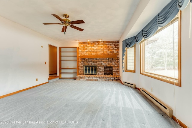 unfurnished living room with a brick fireplace, carpet, baseboards, and baseboard heating