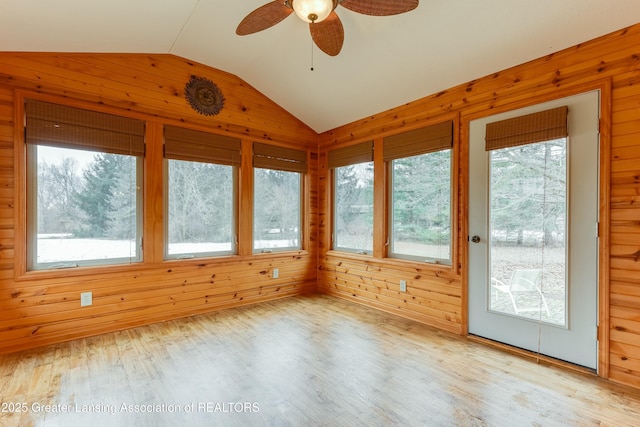 unfurnished sunroom with vaulted ceiling and ceiling fan