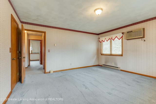 spare room with baseboards, an AC wall unit, baseboard heating, and wallpapered walls