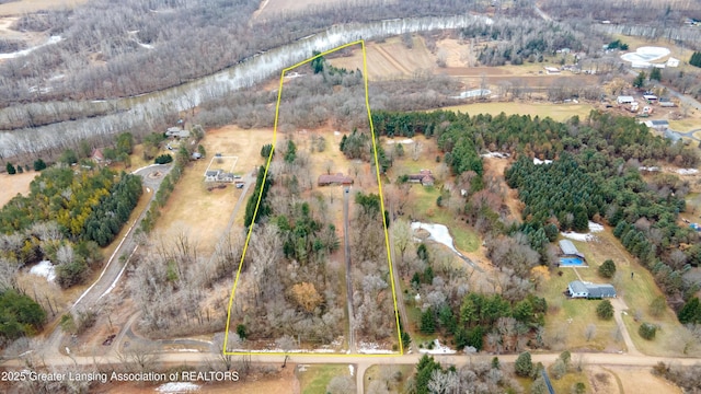 birds eye view of property with a rural view