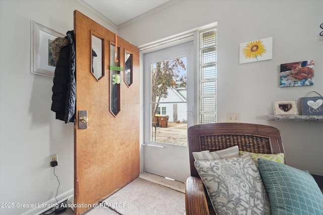 doorway featuring crown molding