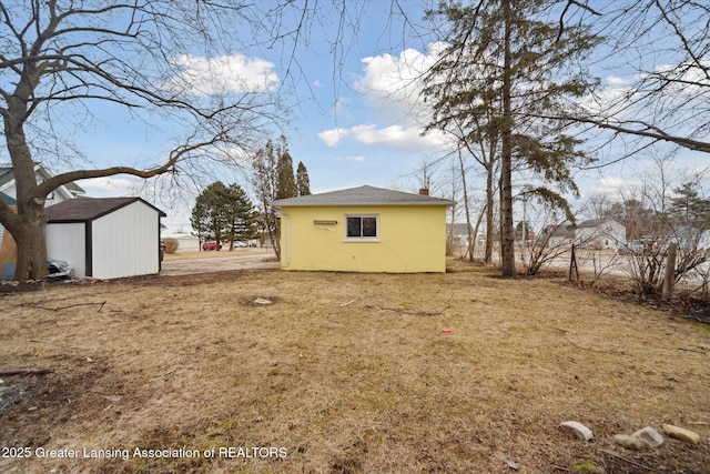 exterior space with an outdoor structure and a storage shed