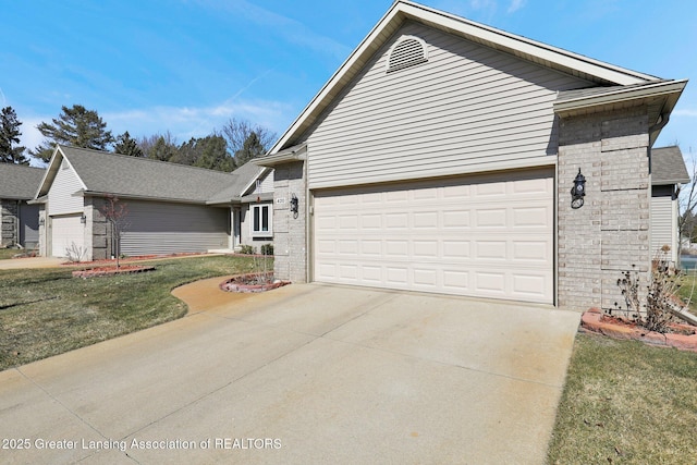 view of front of house with brick siding, concrete driveway, and a garage