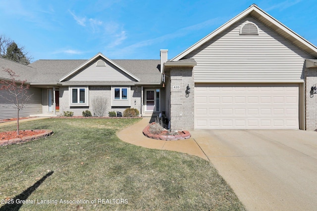 ranch-style house featuring brick siding, a garage, concrete driveway, and a front yard