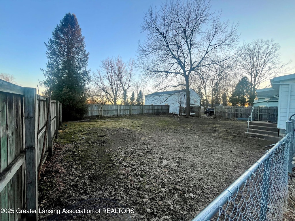 view of yard featuring a fenced backyard