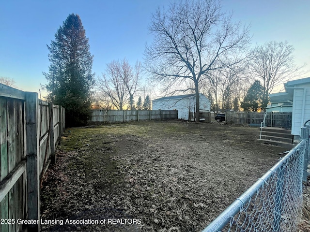 view of yard with a fenced backyard