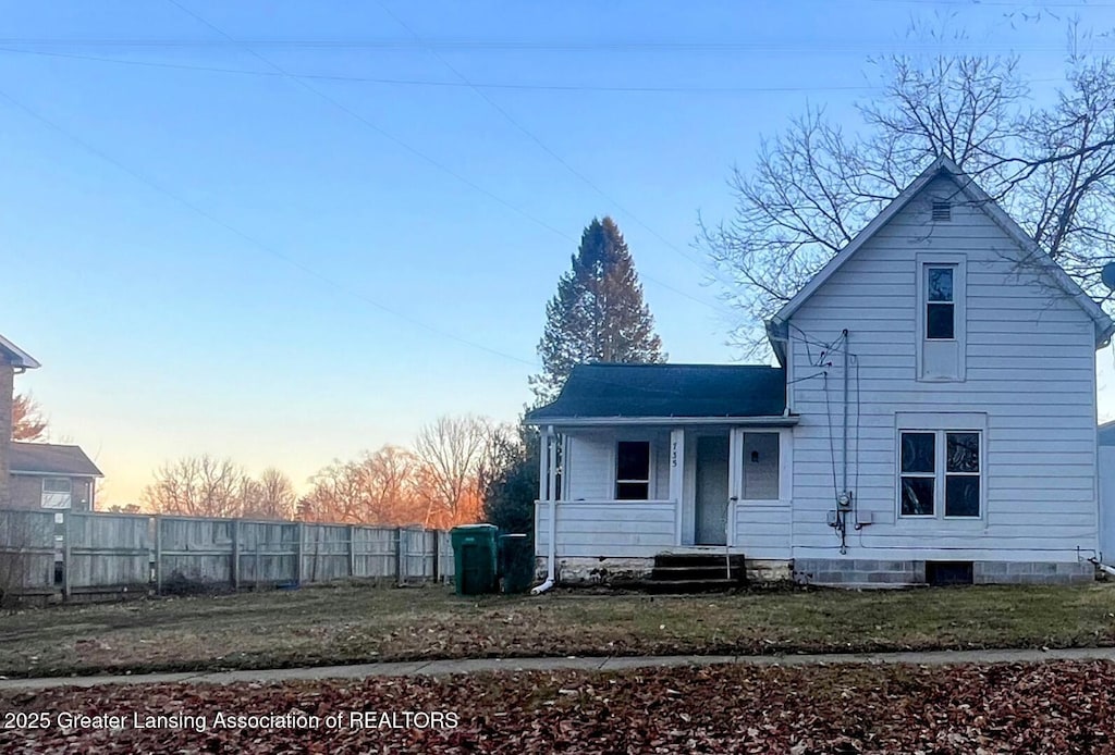 back of property featuring fence