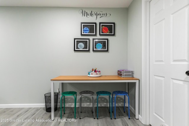 room details featuring baseboards and wood finished floors