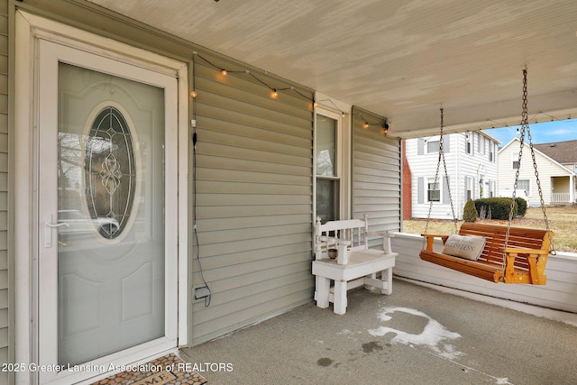 property entrance featuring a porch