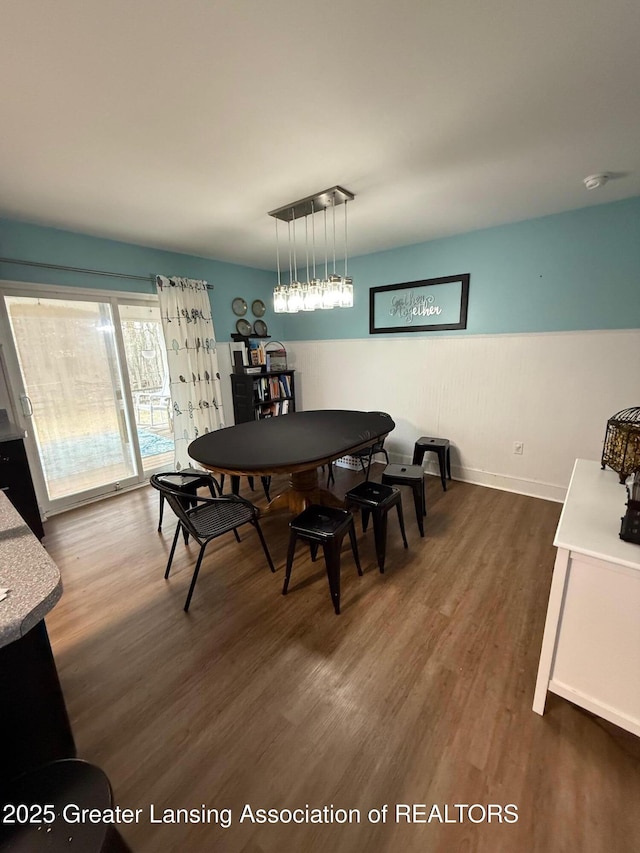 dining area with dark wood-type flooring