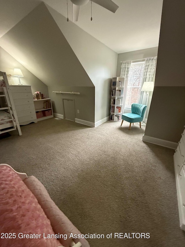 bonus room with lofted ceiling, ceiling fan, carpet flooring, and baseboards