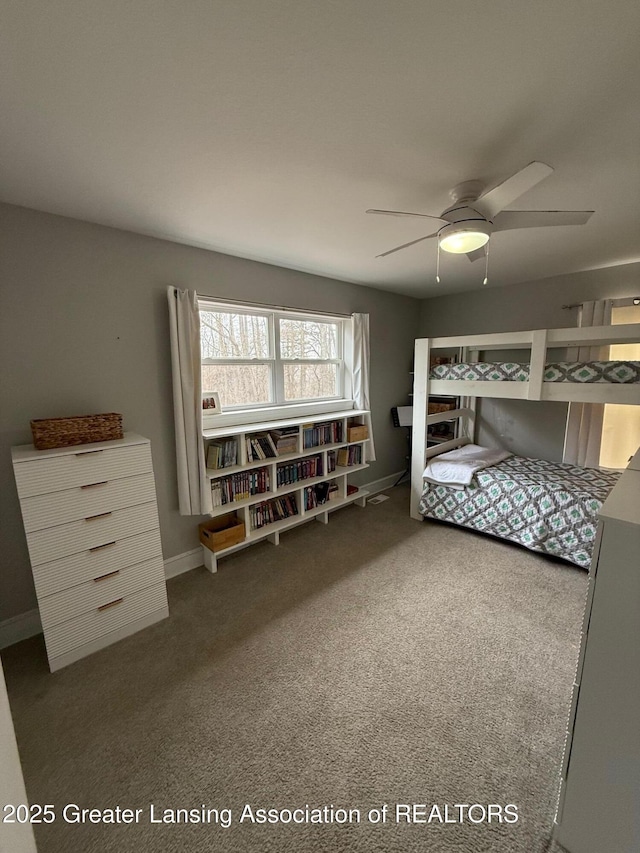 bedroom with carpet flooring, a ceiling fan, and baseboards