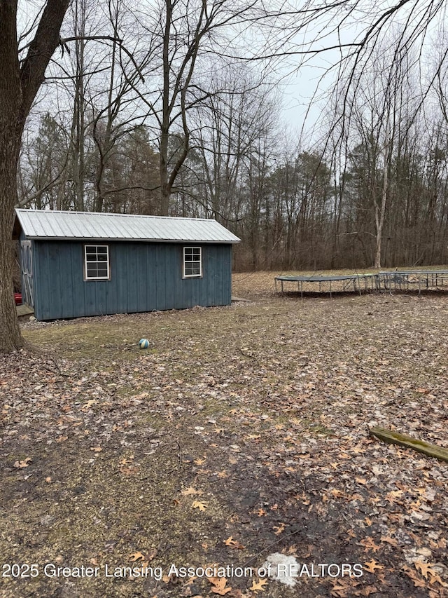 view of yard featuring a trampoline