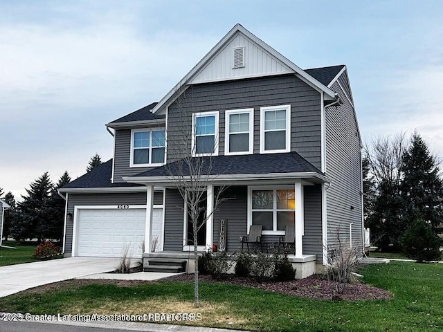 traditional-style home featuring covered porch, concrete driveway, an attached garage, board and batten siding, and a front yard