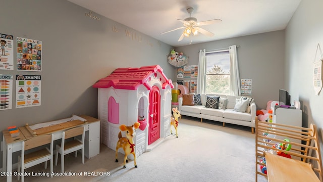 recreation room with ceiling fan and carpet floors