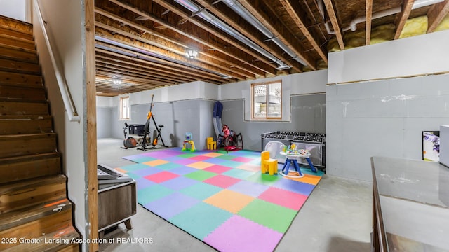 game room with concrete floors