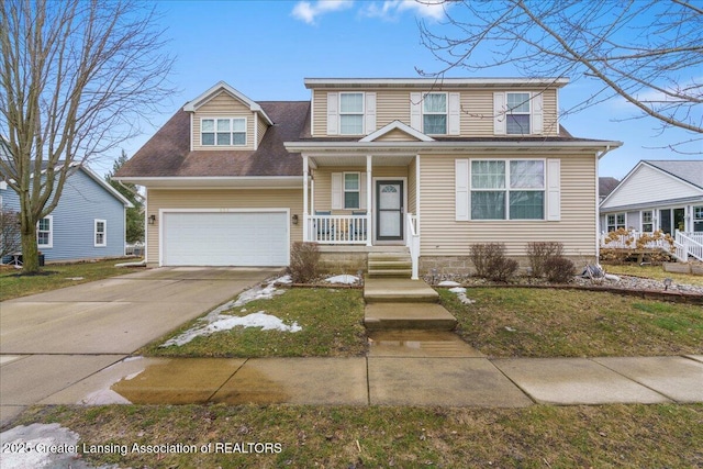 view of front facade featuring driveway and covered porch