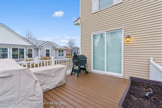 wooden terrace with area for grilling