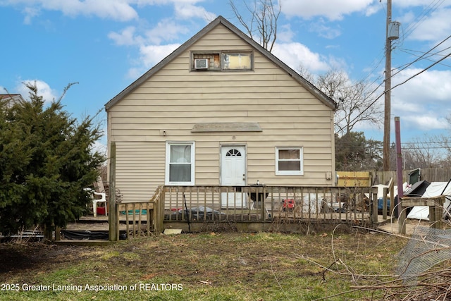 view of front of property with a wooden deck and fence