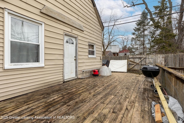 deck featuring fence and area for grilling