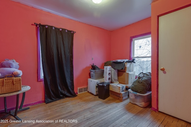 misc room featuring visible vents and hardwood / wood-style floors