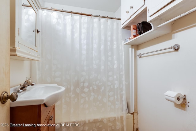 full bathroom featuring vanity and shower / bath combo with shower curtain