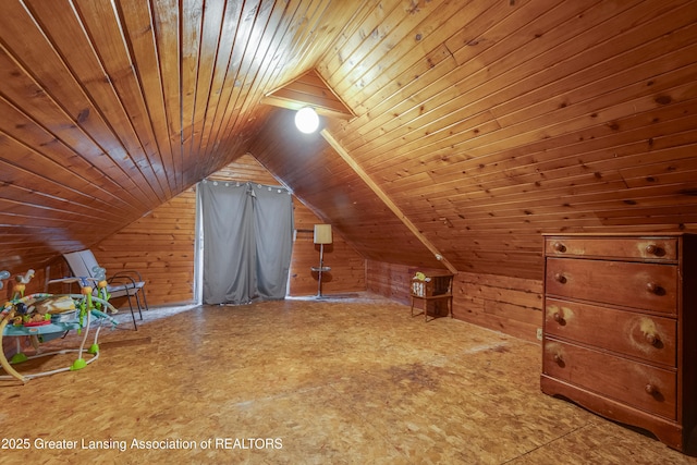 bonus room featuring wood walls, wood ceiling, and vaulted ceiling