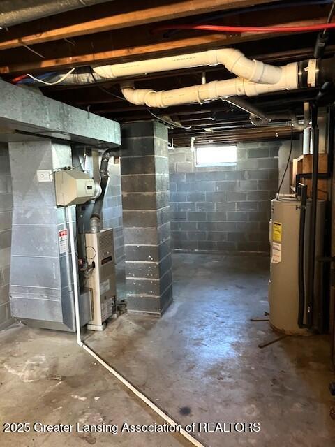 below grade area featuring electric water heater