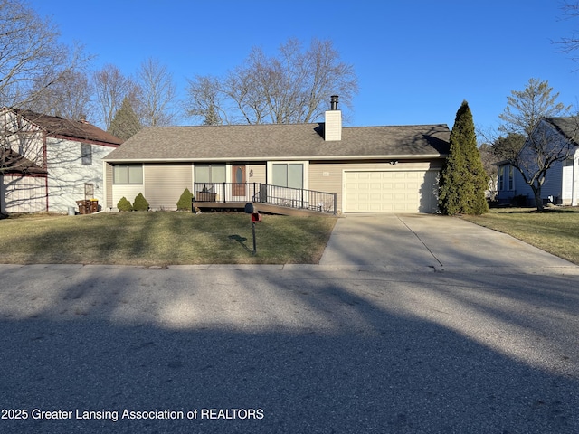 ranch-style house featuring driveway, a garage, a chimney, and a front lawn