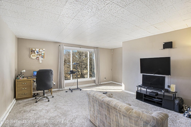 home office featuring a baseboard heating unit, carpet flooring, and baseboards