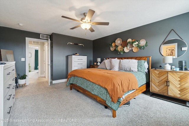 bedroom featuring visible vents, ceiling fan, light carpet, and baseboards