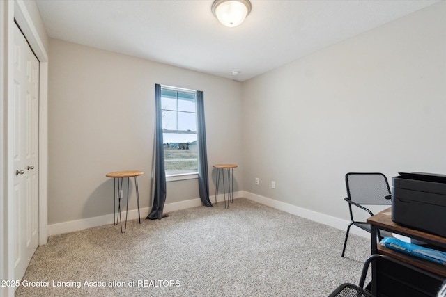 carpeted office space with baseboards