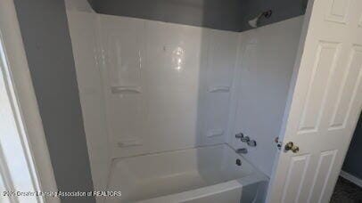 bathroom with shower / bathtub combination