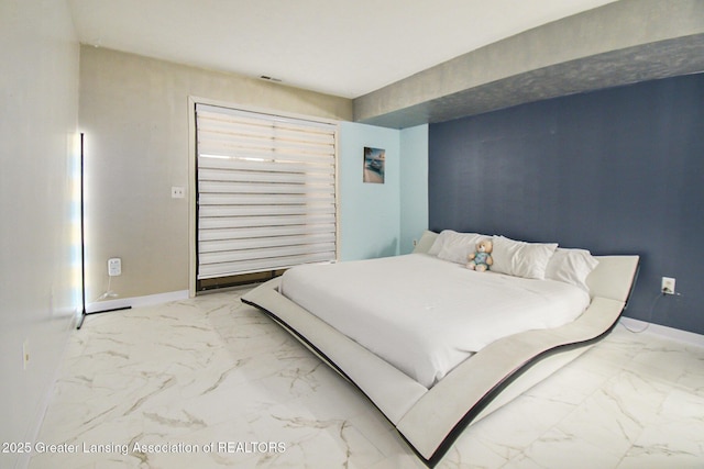 bedroom with visible vents, baseboards, and marble finish floor