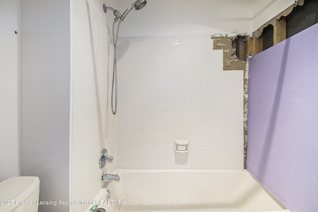 bathroom featuring  shower combination and toilet