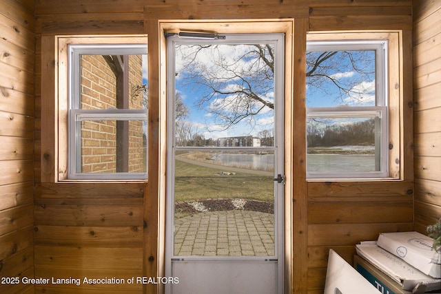 doorway with wooden walls