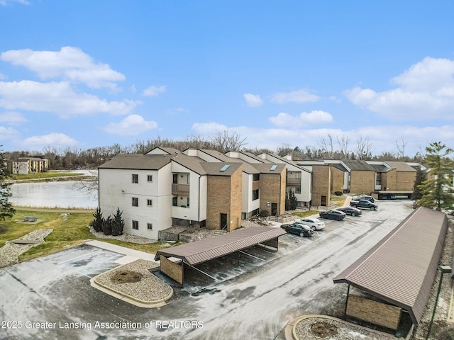 exterior space with a residential view and uncovered parking